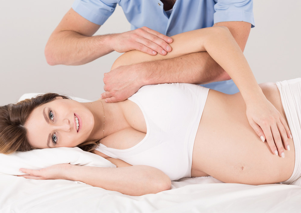 pregnant woman getting chiropractic treatment